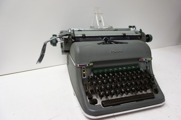 Olympia-Super-de-Luxe-SG1-typemachine-typewriter-plastic-papiergeleider-card-guide-vintage-schreibmaschine-1961