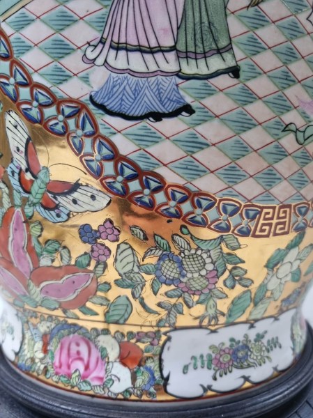 Detailed view of hand-painted porcelain artwork depicting a traditional Chinese court scene with figures in a courtyard